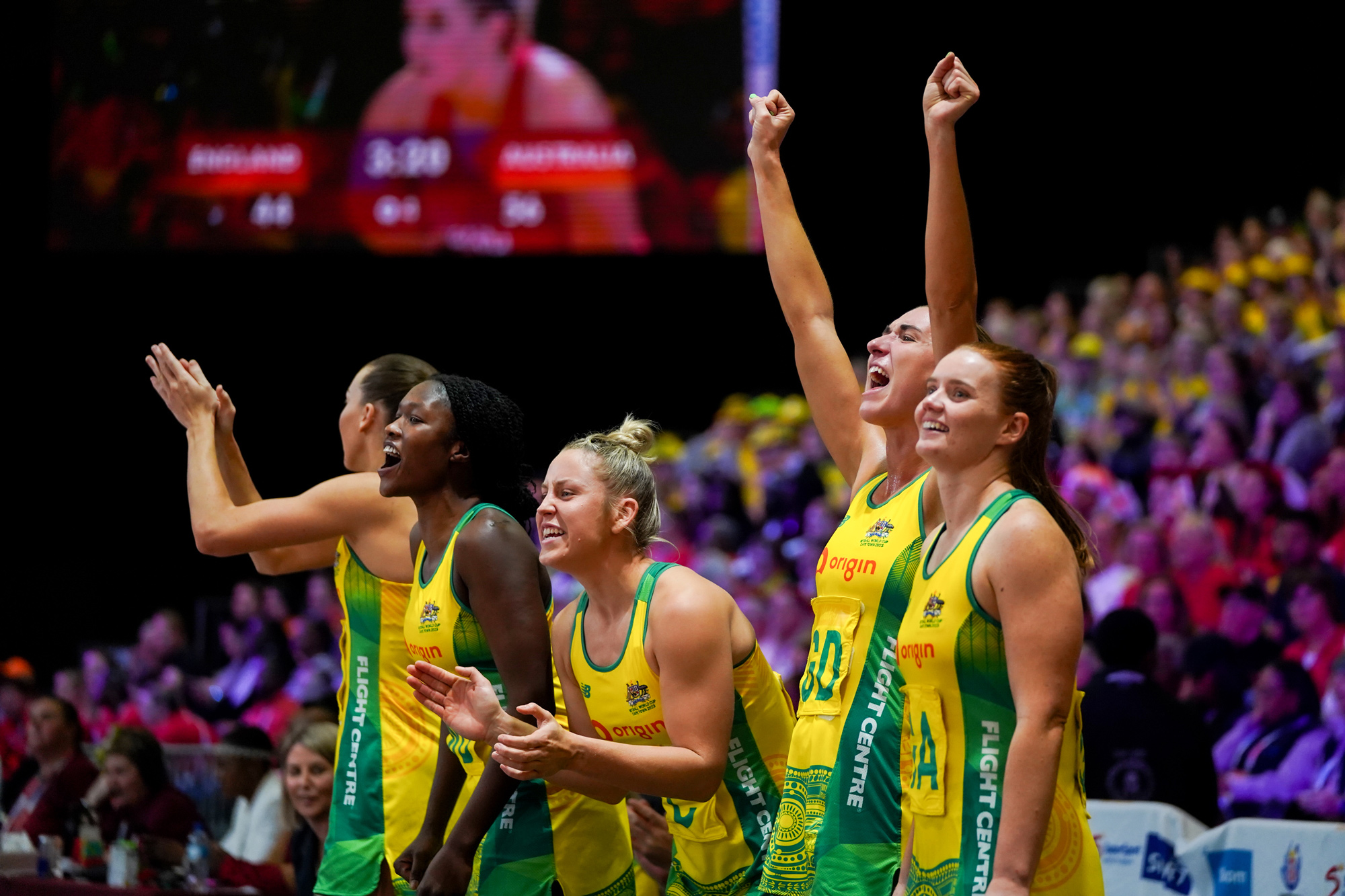 Diamonds players cheer on from the bench