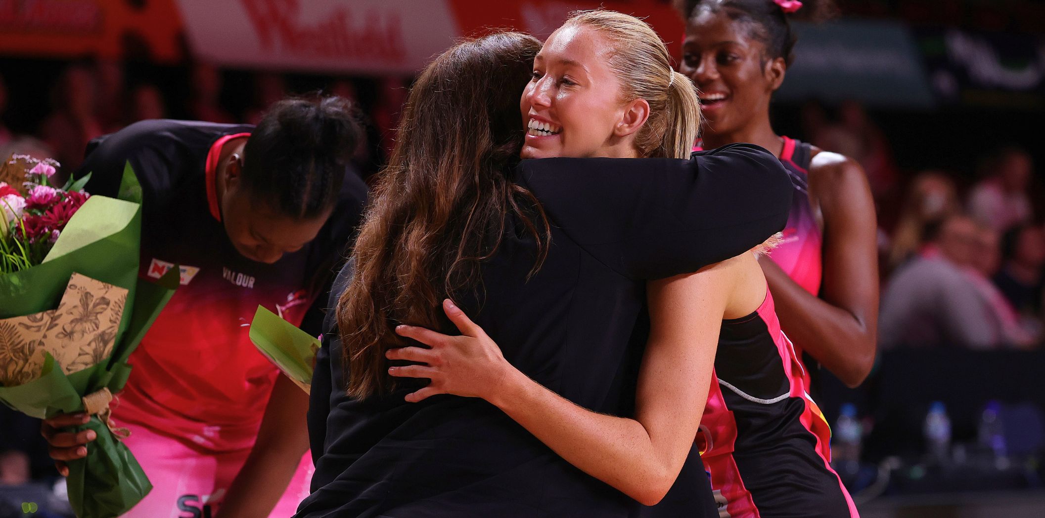 Tania Obst and Lauren Frew embrace 