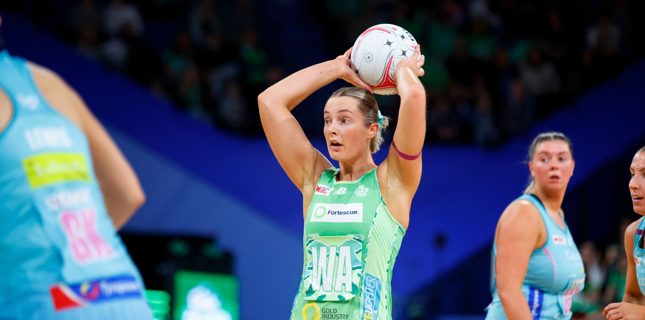 Alice Teague-Neeld looks to pass overhead against the Mavericks