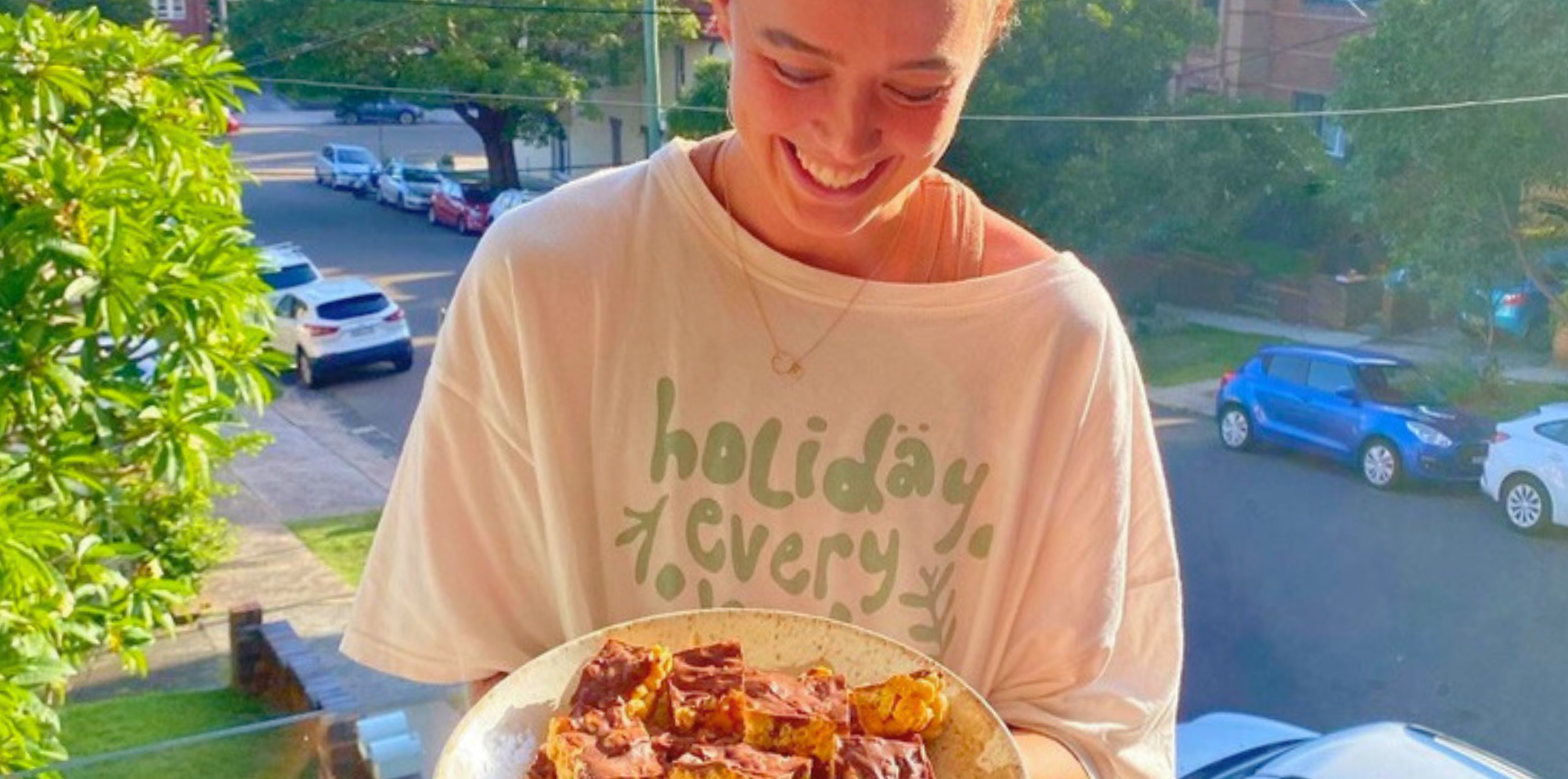 Teigan O'Shannassy holds a plate of baked goods