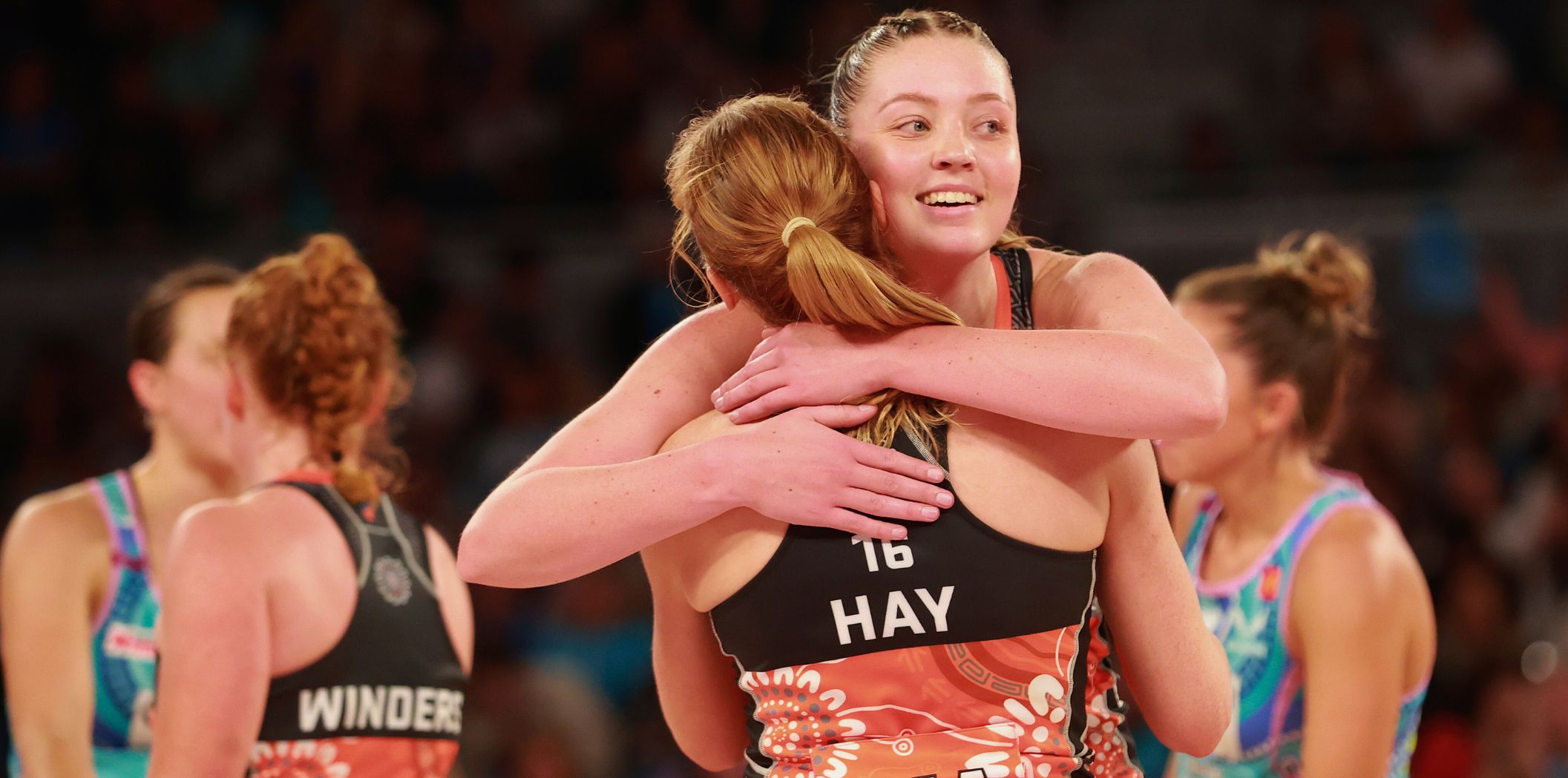 Sophie Dwyer and Maddie Hay embrace after a win