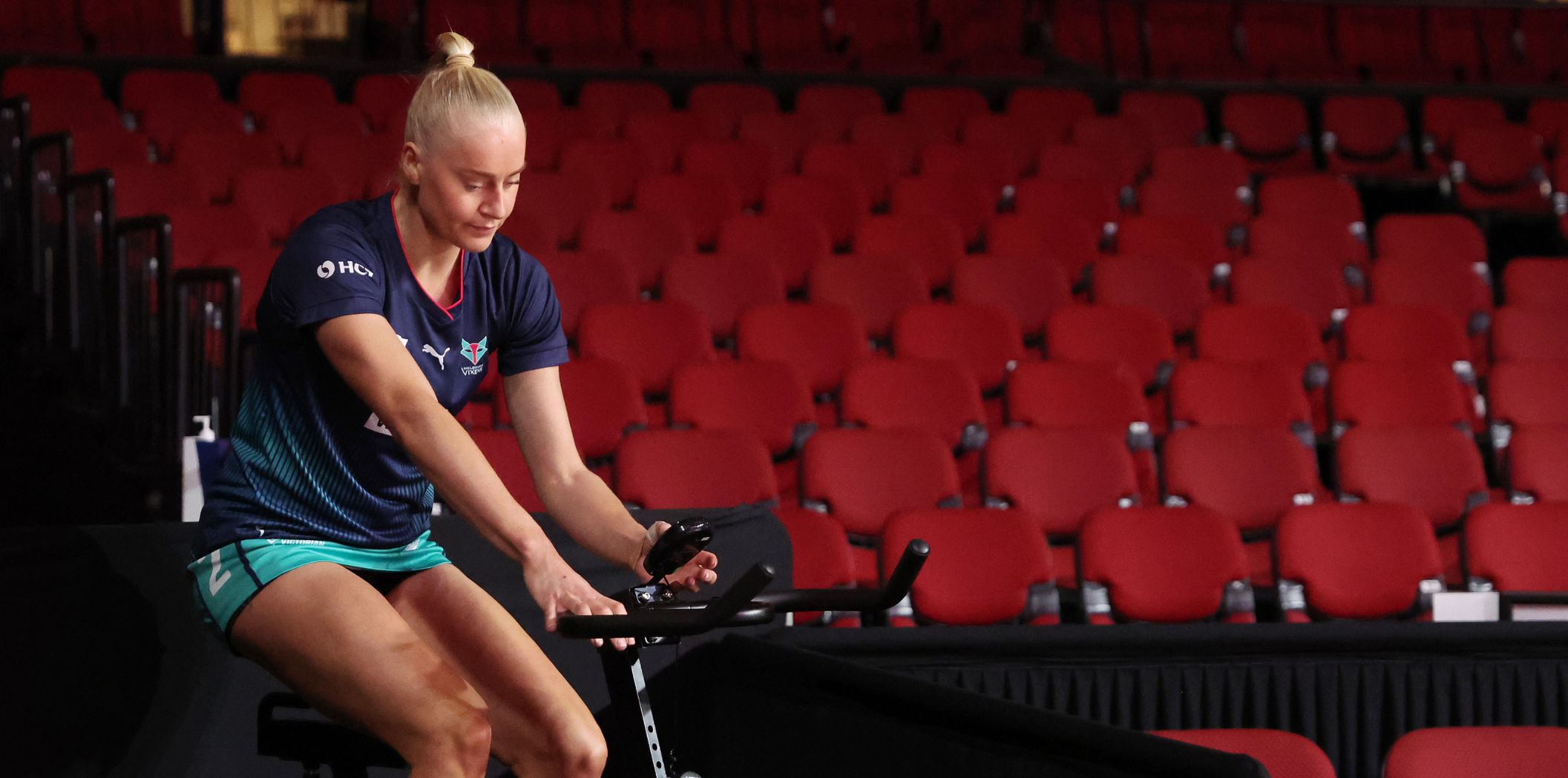 Jo Weston rides an exercise bike