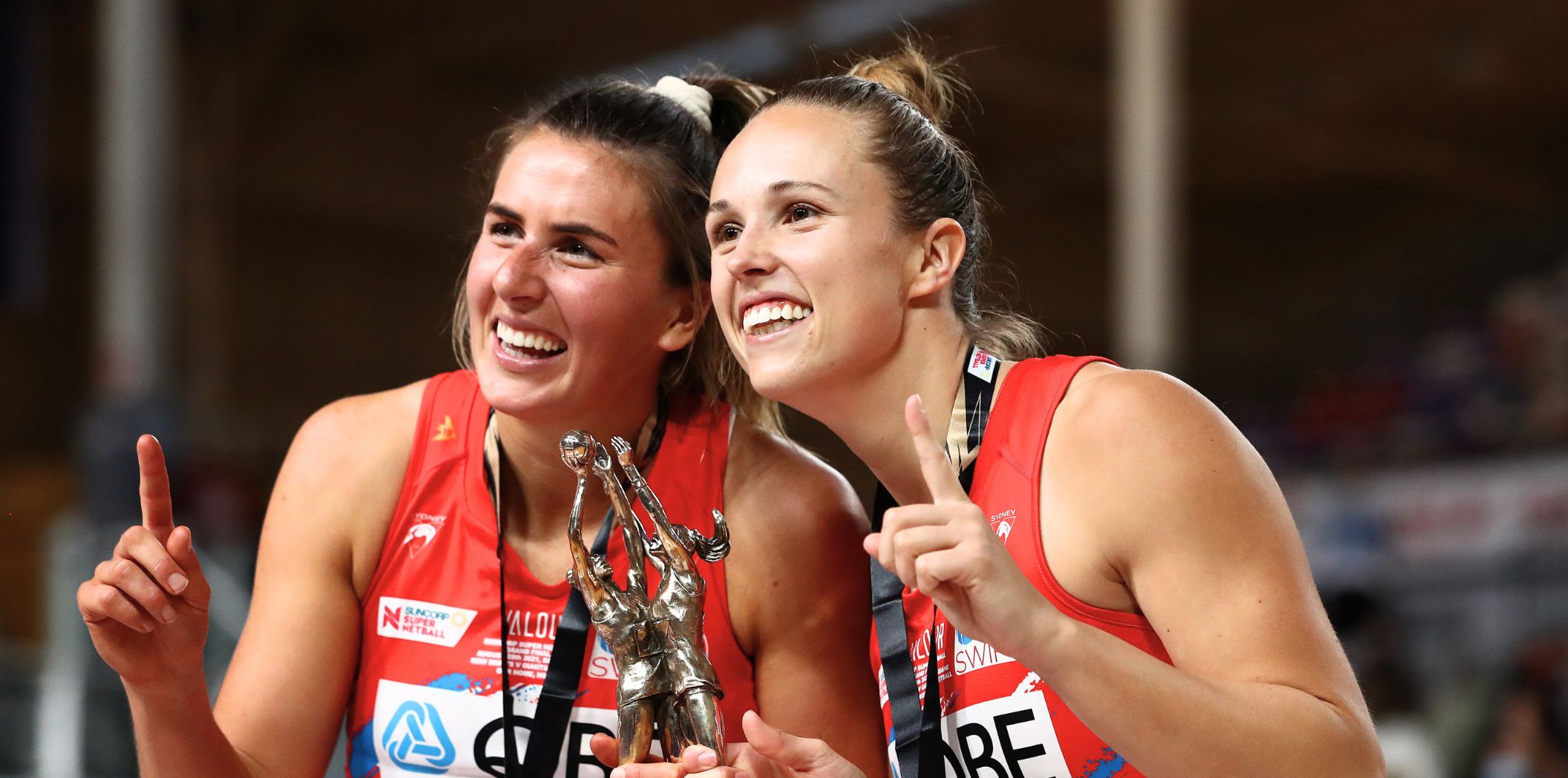 Maddy Proud and Paige Hadley celebrate the 2021 Premiership