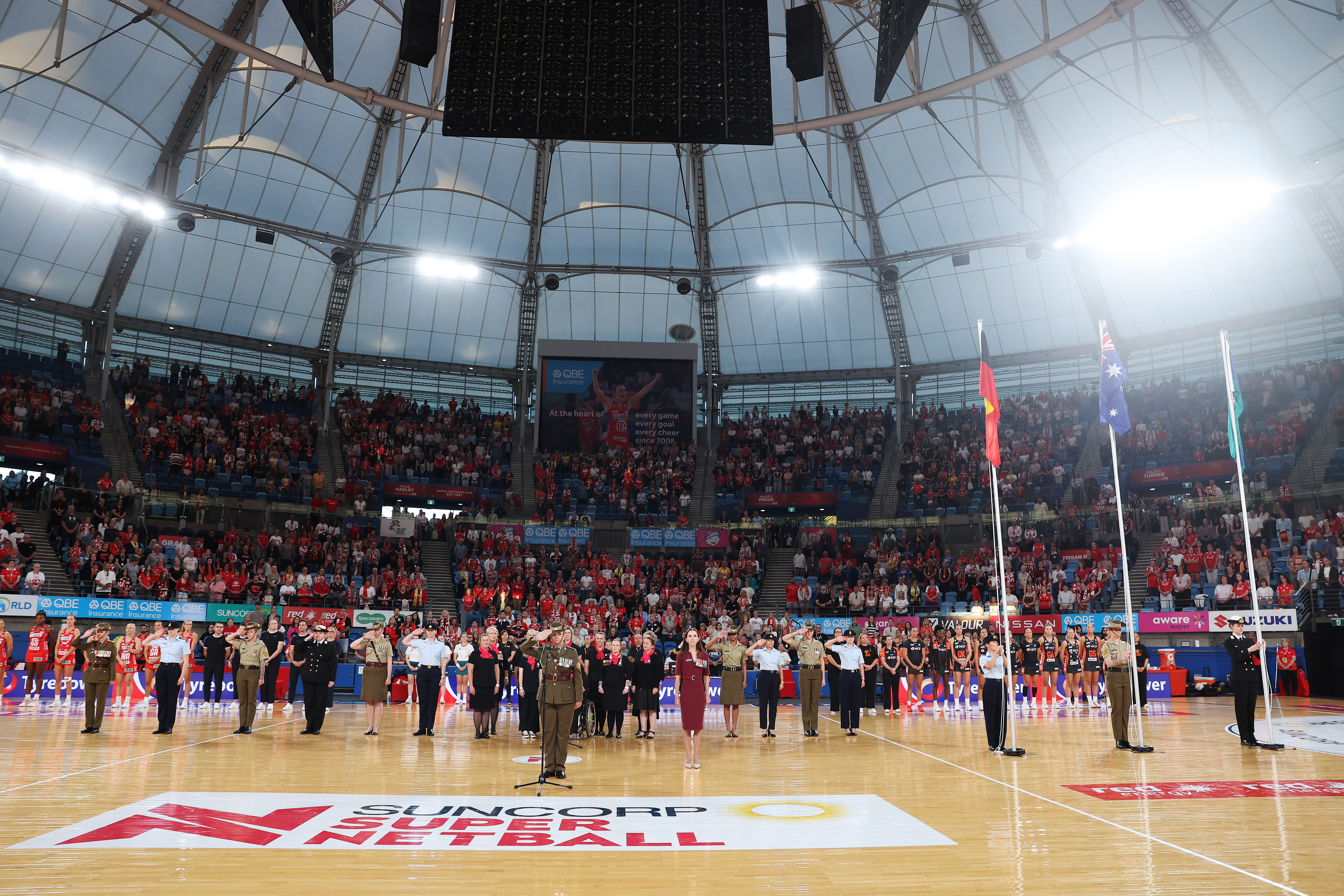 A moment of reflection during the Anzac observance at Ken Rosewall Arena before NSW Swifts face Giants.