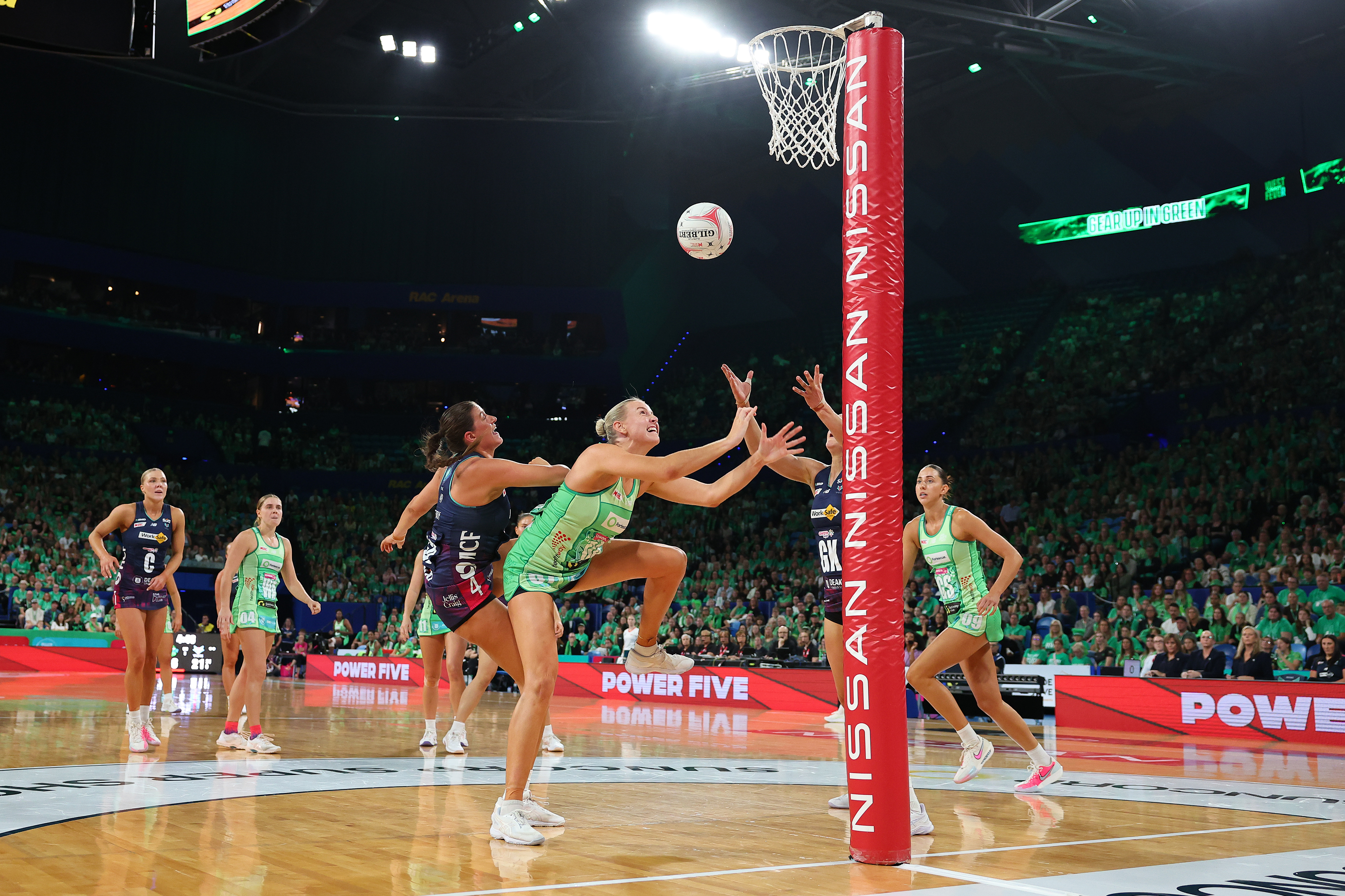 Sasha Glasgow and Kate Eddy in a strong contest for the rebound.